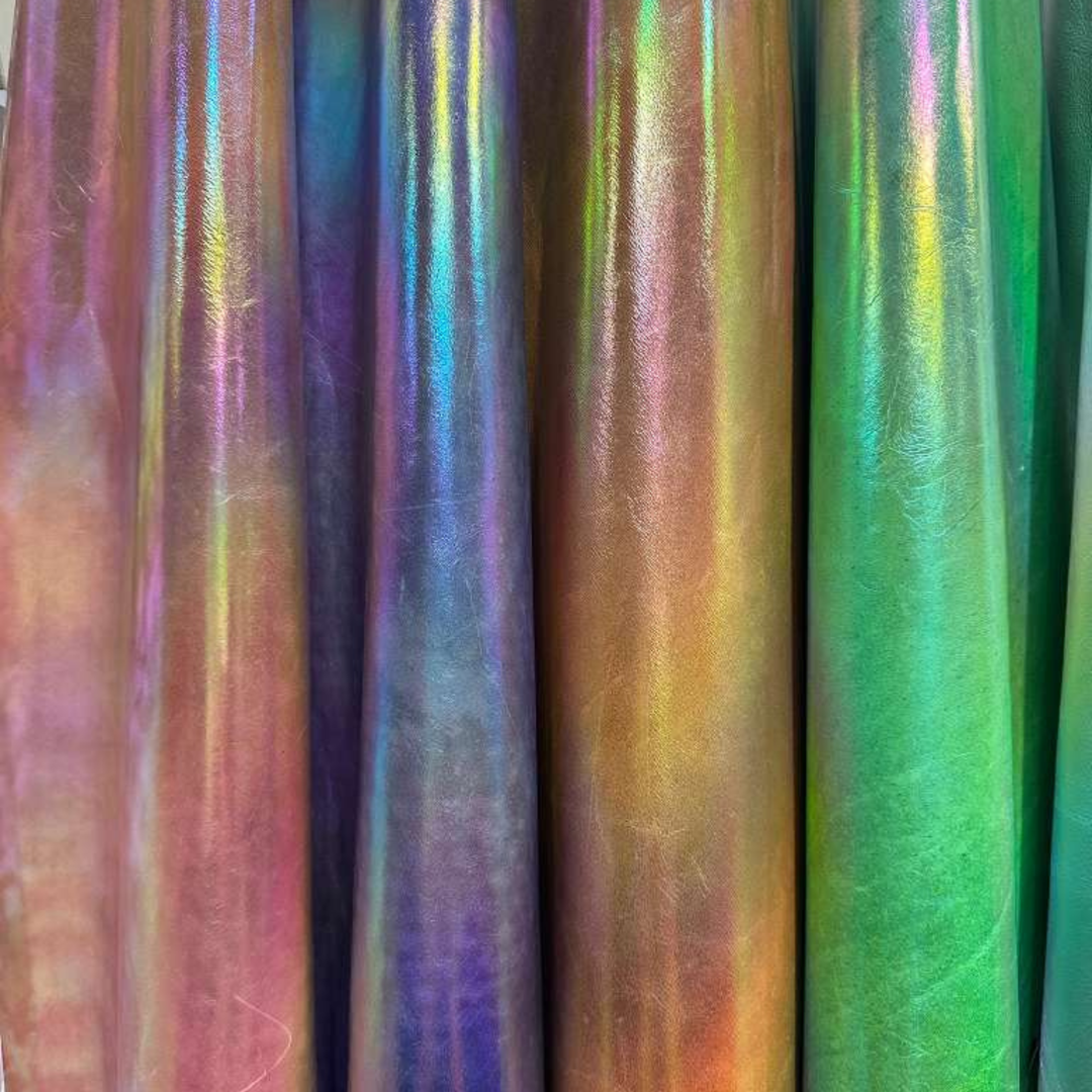 Genuine metallic leather hides with metallic finishes in multiple colors, showcasing a smooth, reflective surface