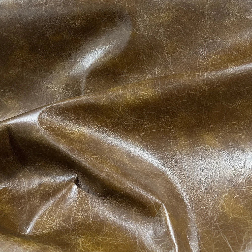 Close-up of brown leather fabric with visible texture