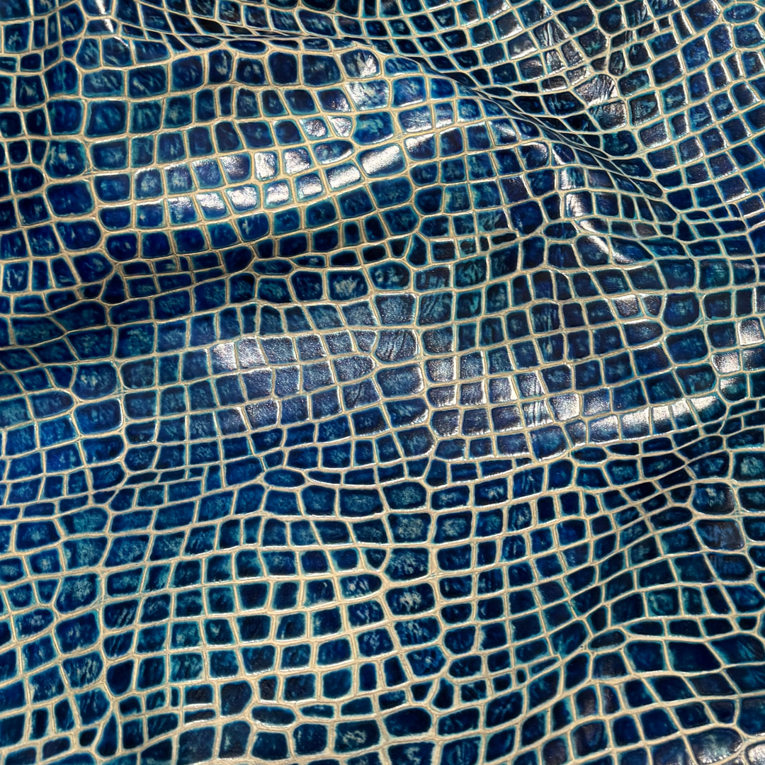 Mellody Collection embossed leather in Frozen Crystal blue with exotic-inspired texture and glossy finish for luxury handbags and designer leather goods.
