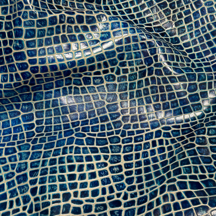 Mellody Collection embossed leather in Frozen Crystal blue with exotic-inspired texture and glossy finish for luxury handbags and designer leather goods.